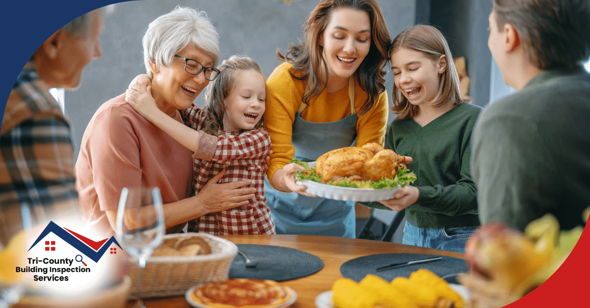 Family gathered around the table with a woman presenting a roasted turkey, surrounded by smiling family members.