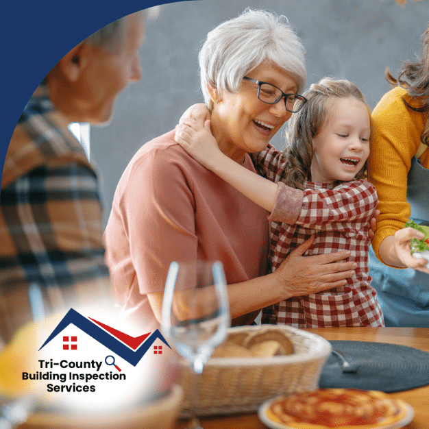 Family gathered around the table with a woman presenting a roasted turkey, surrounded by smiling family members.